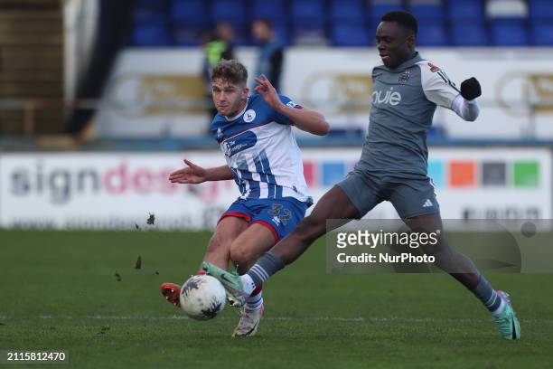 Louis Stephenson of Hartlepool United is in action with Andrew Oluwabori of Halifax Town during the Vanarama National League match between Hartlepool...