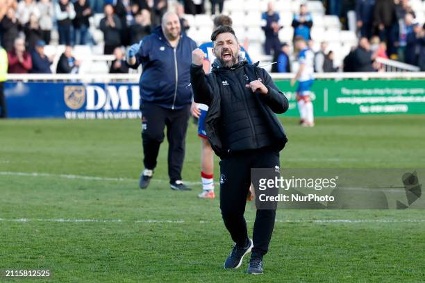 Kevin Phillips, the manager of Hartlepool United, is celebrating with their fans following their victory in the Vanarama National League match...