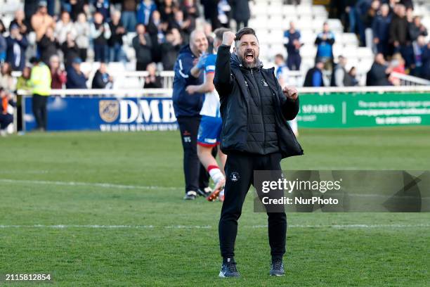 Kevin Phillips, the manager of Hartlepool United, is celebrating with their fans following their victory in the Vanarama National League match...