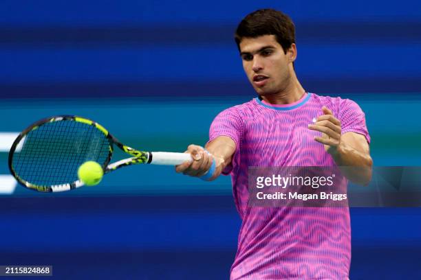 Carlos Alcaraz of Spain returns a shot to Lorenzo Musetti of Italy during his men's singles match during the Miami Open at Hard Rock Stadium on March...