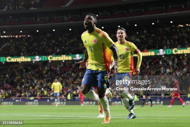 Jhon Cordoba of Colombia celebrates scoring their opening goal with teammate James Rodriguez during the friendly match between Romania and Colombia...