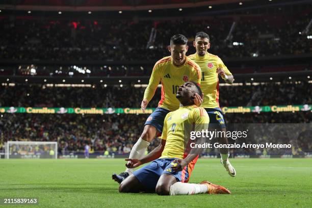 Jhon Cordoba of Colombia celebrates scoring their opening goal with teammates James Rodriguez and Daniel Munoz during the friendly match between...