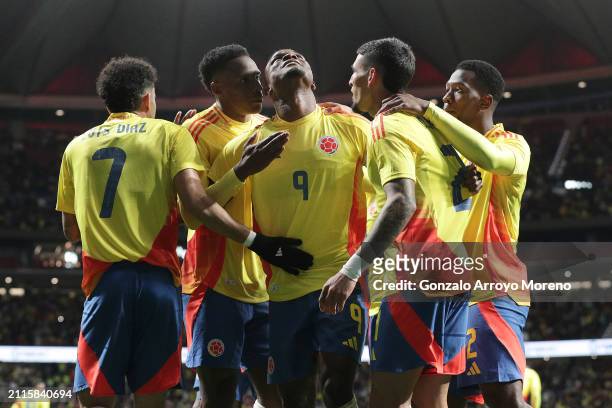 Jhon Cordoba of Colombia celebrates scoring their opening goal with teammates during the friendly match between Romania and Colombia at Civitas...