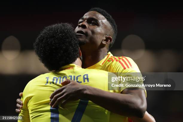 Jhon Cordoba of Colombia celebrates scoring their opening goal with teammate Johan Mojica during the friendly match between Romania and Colombia at...