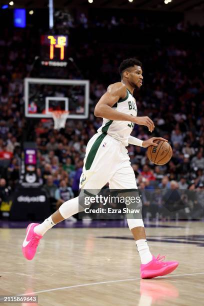 Giannis Antetokounmpo of the Milwaukee Bucks dribbles the ball against the Sacramento Kings at Golden 1 Center on March 12, 2024 in Sacramento,...