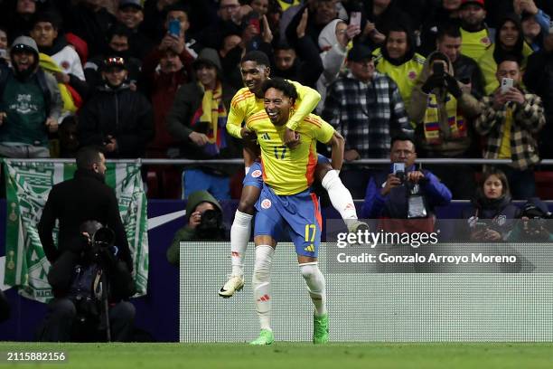 Yaser Asprilla of Colombia celebrates scoring their third goal with teammate Johan Mojica during the friendly match between Romania and Colombia at...