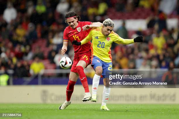 Ianis Hagi of Romania competes for the ball with Juan Fernando Quintero of Colombia during the friendly match between Romania and Colombia at Civitas...