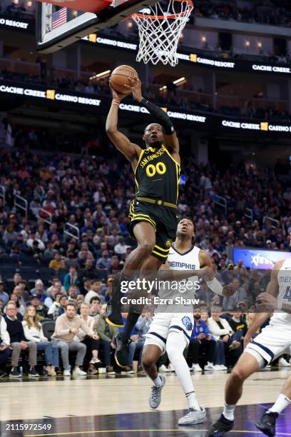 Jonathan Kuminga of the Golden State Warriors goes up for a dunk against the Memphis Grizzlies at Chase Center on March 20, 2024 in San Francisco,...