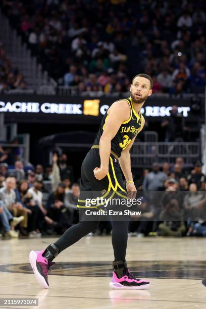Stephen Curry of the Golden State Warriors watches his shot against the Memphis Grizzlies at Chase Center on March 20, 2024 in San Francisco,...