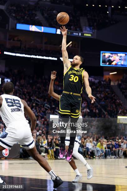 Stephen Curry of the Golden State Warriors shoots the ball against the Memphis Grizzlies at Chase Center on March 20, 2024 in San Francisco,...