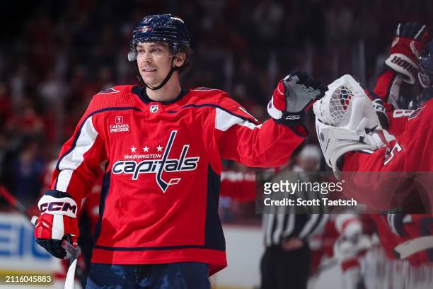 Dylan Strome of the Washington Capitals celebrates with teammates after scoring a goal against the Detroit Red Wings during the third period of the...