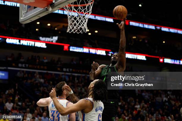 Zion Williamson of the New Orleans Pelicans shoots the ball over Jaylin Williams of the Oklahoma City Thunder at Smoothie King Center on March 26,...