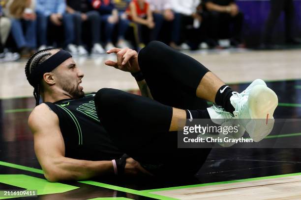Jose Alvarado of the New Orleans Pelicans lies on the ground after an injury against the Oklahoma City Thunder at Smoothie King Center on March 26,...