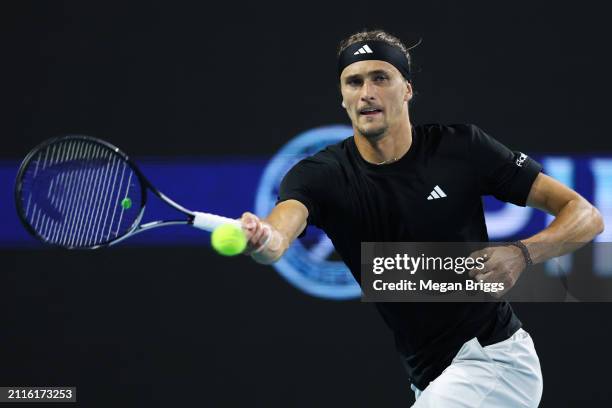 Alexander Zverev of Germany returns a shot to Karen Khachanov during his men's singles round of 16 match during the Miami Open at Hard Rock Stadium...