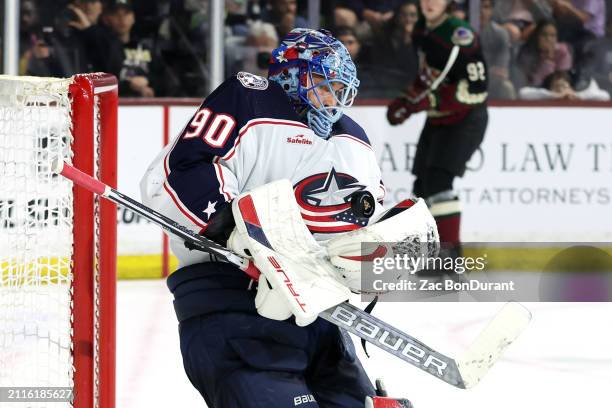 Elvis Merzlikins of the Columbus Blue Jackets makes a save against the Arizona Coyotes during the second period at Mullett Arena on March 26, 2024 in...