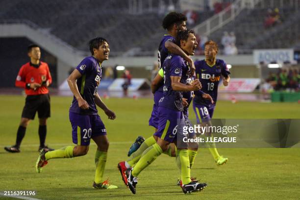 Toshihiro Aoyama of Sanfrecce Hiroshima celebrates with teammateafter scoring the team's first goal during the J.League J1 match between Sanfrecce...