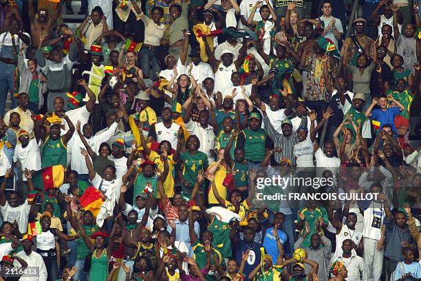 Cameroon's fans celebrate at the end of the soccer Confederations Cup match against Turkey 21 June 2003, at the Stade de France in Saint-Denis near...
