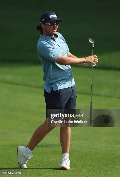 Ewen Ferguson of Scotland plays a shot prior to the Hero Indian Open at DLF Golf and County Club on March 27, 2024 in New Delhi, India