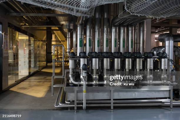 pipes in the basement of a brewery - 福建省 stock pictures, royalty-free photos & images