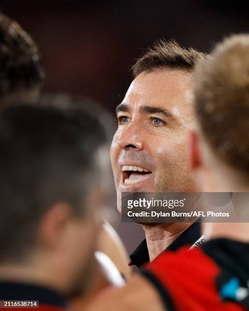 Brad Scott, Senior Coach of the Bombers addresses his players during the 2024 AFL Round 03 match between the Essendon Bombers and the St Kilda Saints...