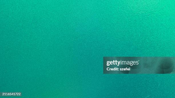 green glowing glittering background. light and shadow - azul turquesa imagens e fotografias de stock