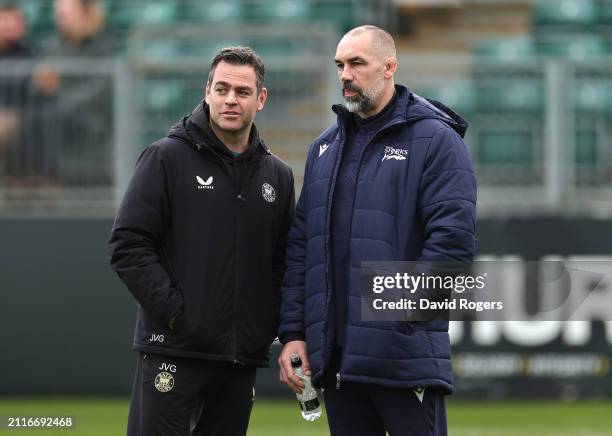 Johann van Graan, the Bath Rugby head of rugby, talks with Sale Sharks director of rugby, Alex Sanderson prior to the Gallagher Premiership Rugby...