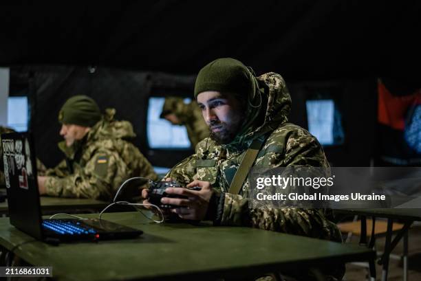 Recruit of the 1st Separate Mechanized Battalion ‘Da Vinci Wolves’ named after Dmytro Kotsiubailo trains and learns to work with FPV strike drones...