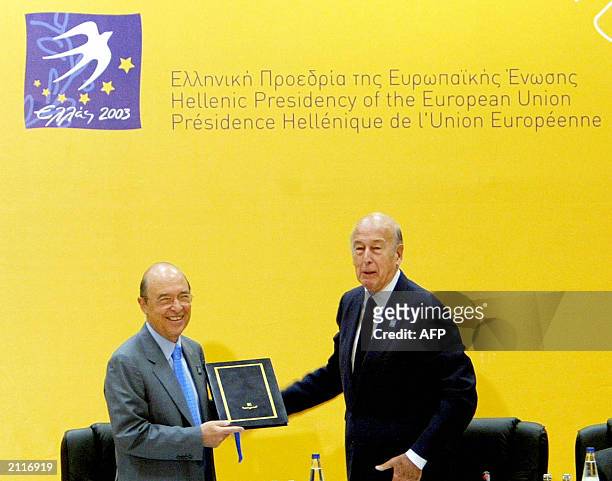 French President of the European Convention Valery Giscard d'Estaing hands the final draft of the European Convention to Greek Prime Minister Costas...