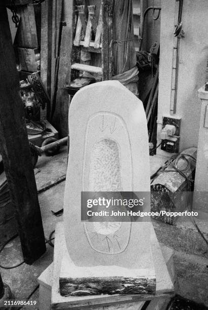 View of a piece of stone being carved and worked on in the studio workspace of English artist and sculptor Barbara Hepworth, Trwyn Studios in St...