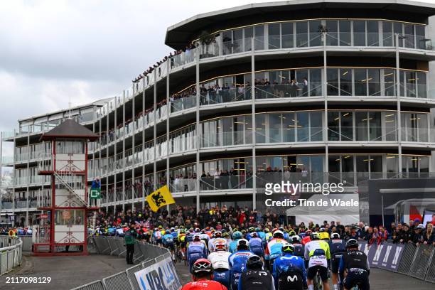 General view of the peloton competing close to the Hippodroom in Waregem city while fans cheer during the 78th Dwars Door Vlaanderen 2024 - Men's...