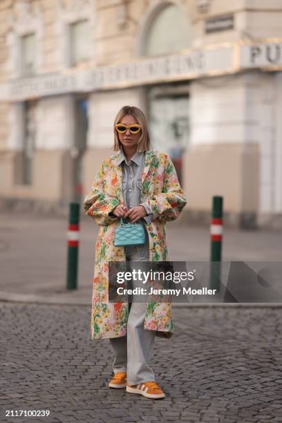 Karin Teigl seen wearing Loewe yellow sunglasses, Agolde light grey denim buttoned jeans shirt, matching Agolde light grey denim straight leg pants,...