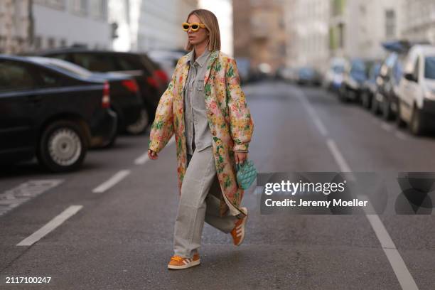 Karin Teigl seen wearing Loewe yellow sunglasses, Agolde light grey denim buttoned jeans shirt, matching Agolde light grey denim straight leg pants,...