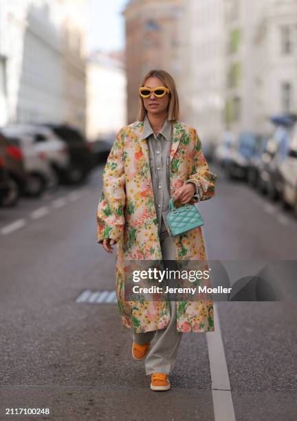 Karin Teigl seen wearing Loewe yellow sunglasses, Agolde light grey denim buttoned jeans shirt, matching Agolde light grey denim straight leg pants,...