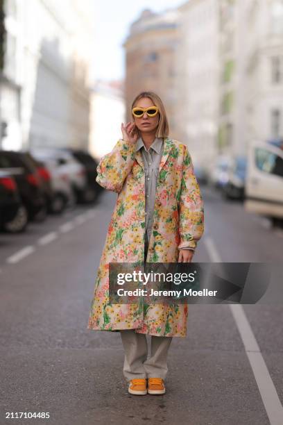 Karin Teigl seen wearing Loewe yellow sunglasses, Agolde light grey denim buttoned jeans shirt, matching Agolde light grey denim straight leg pants,...