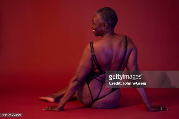 rear view portrait of black senior in semi-dress - mb stock pictures, royalty-free photos & images