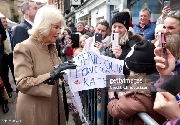 Queen Camilla receives a message of support for Catherine, Princess of Wales from well-wishers during her visit to the Farmers' Market on March 27,...