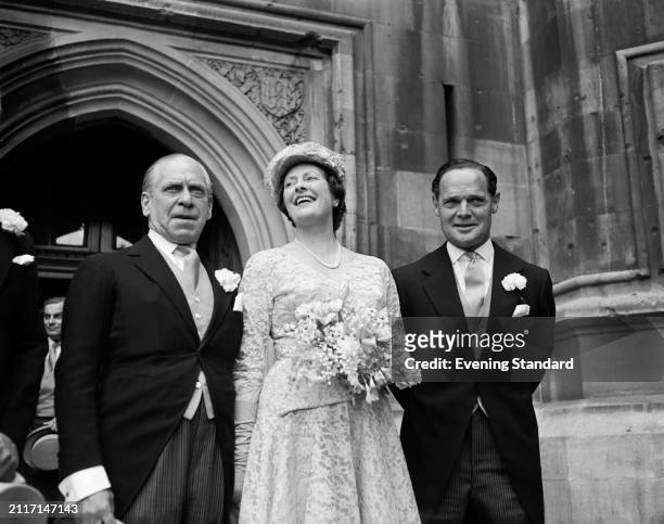 Conservative Party politician Peter MacDonald with his wife Phoebe on their wedding day with Best Man Douglas Bader , May 22nd 1956.