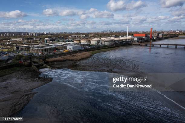 Permitted treated final effluent discharge flows into the River Thames at Crossness sewage treatment works on March 27, 2024 in London, England.