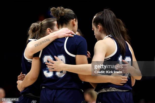 The Maine Black Bears huddle up prior to the start of the NCAA Women's Basketball Tournament First Round game against the Ohio State Buckeyes at the...