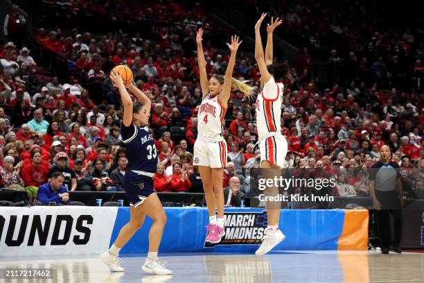 Jacy Sheldon of the Ohio State Buckeyes and Celeste Taylor defend against Adrianna Smith of the Maine Black Bears during the NCAA Women's Basketball...