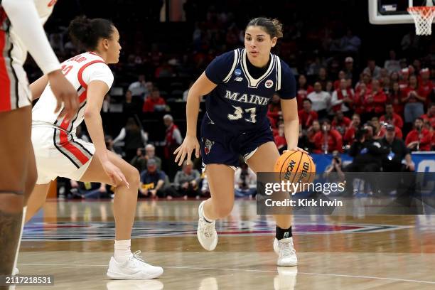 Adrianna Smith of the Maine Black Bears controls the ball during the NCAA Women's Basketball Tournament First Round game against the Ohio State...