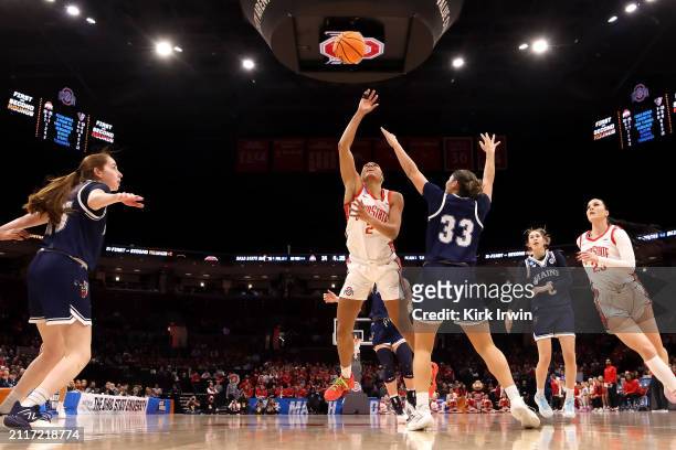 Taylor Thierry of the Ohio State Buckeyes shoots the ball while being defended by Adrianna Smith of the Maine Black Bears during the NCAA Women's...
