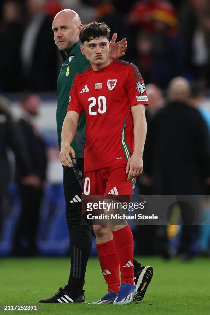 Daniel James of Wales is consoled by Head Coach Rob Page after after missing his penalty in the penalty shoot out during the UEFA EURO 2024 Play-Offs...