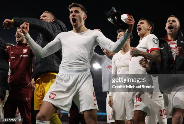 Jan Bednarek of Poland leads his teams celebrations following the penalty shoot out during the UEFA EURO 2024 Play-Offs semifinal match between Wales...