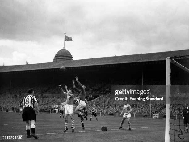 Manchester United Football Club goalkeeper Bert Trautmann reaches up to catch the ball during the FA Cup Final, Wembley Stadium, London, May 7th...