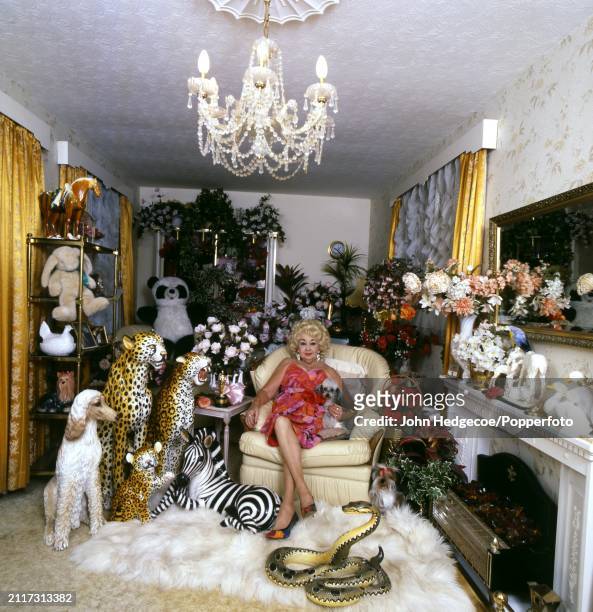 Animal benefactor Kay Lockwood posed with a pet dog in the living room of her house in Surrey, England in 1993. Kay Lockwood, sister-in-law of the...