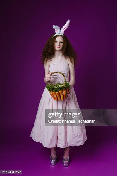 beautiful girl wearing pink dress - costume rabbit ears stock pictures, royalty-free photos & images