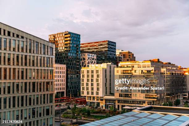 modern office and apartment buildings in bjorvika district at sunset, high angle view, oslo, norway - oslo business stock pictures, royalty-free photos & images