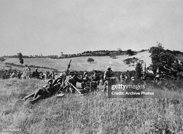 Column of French troops from the Allied Armée d'Orient operate two St Étienne Mle 1907 Mitrailleuse Mle 1907 T gas operated air-cooled 8mm machine...