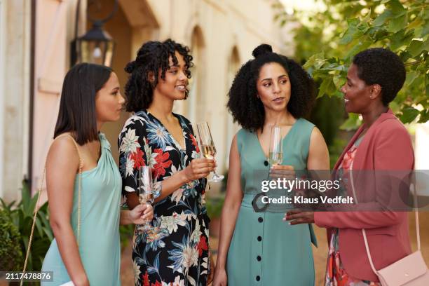 multiracial female guests with alcoholic drinks - guest stock pictures, royalty-free photos & images